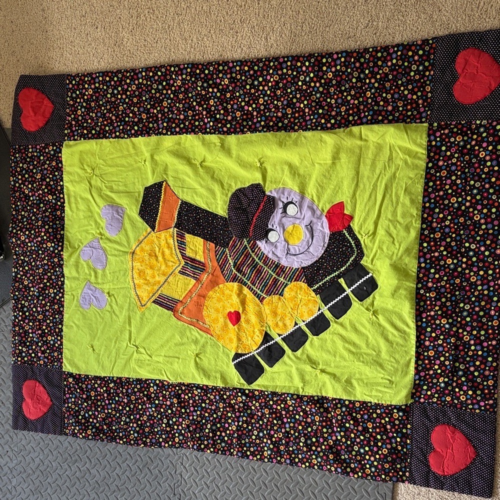 Playful Train-Themed Quilt with Vibrant Accents